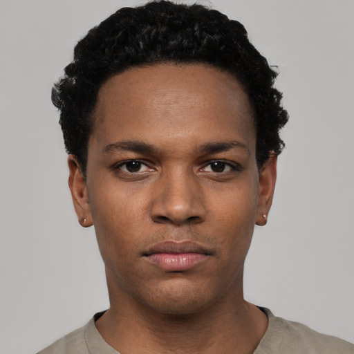 Neutral black young-adult male with short  black hair and brown eyes