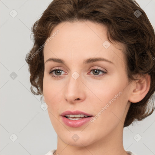 Joyful white young-adult female with medium  brown hair and green eyes