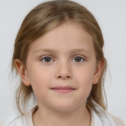 Joyful white child female with medium  brown hair and grey eyes