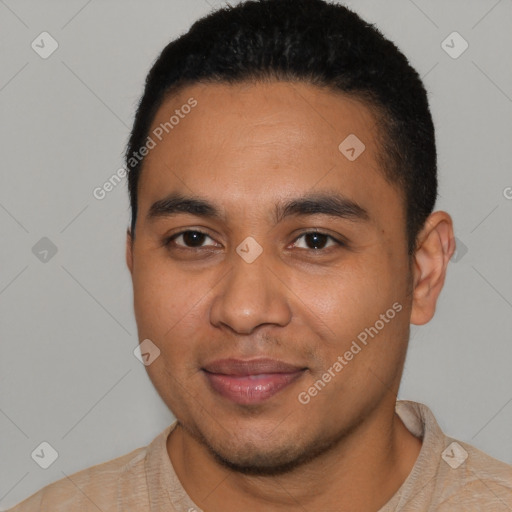 Joyful latino young-adult male with short  black hair and brown eyes