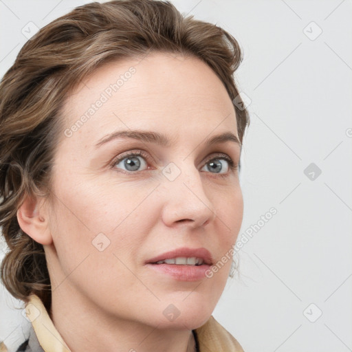 Joyful white young-adult female with long  brown hair and blue eyes