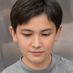 Joyful white child male with short  brown hair and brown eyes