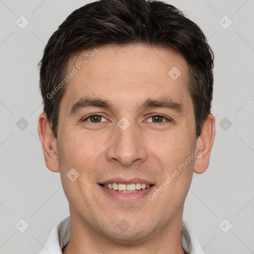 Joyful white young-adult male with short  brown hair and brown eyes