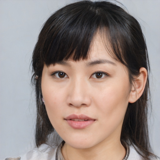 Neutral asian young-adult female with medium  brown hair and brown eyes