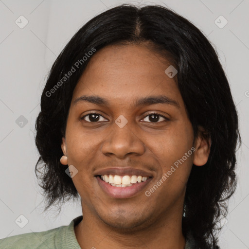 Joyful black young-adult female with long  black hair and brown eyes