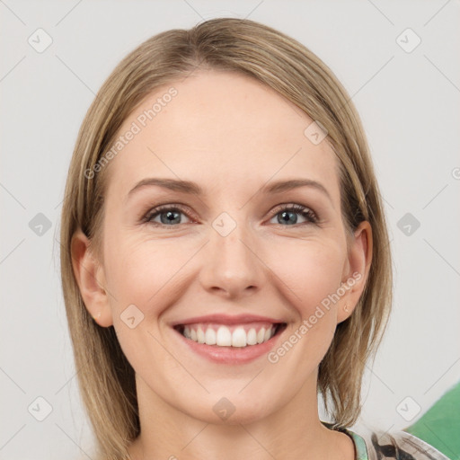 Joyful white young-adult female with medium  brown hair and green eyes