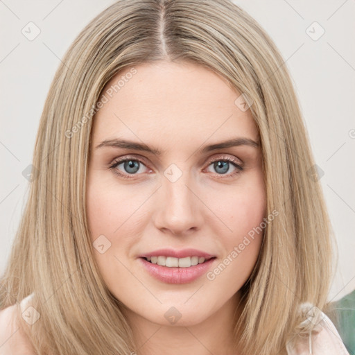 Joyful white young-adult female with long  brown hair and green eyes