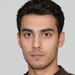 Neutral white young-adult male with short  black hair and brown eyes