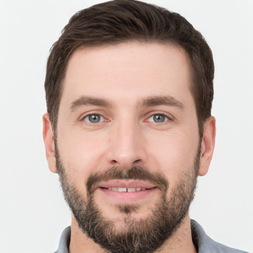 Joyful white young-adult male with short  brown hair and brown eyes