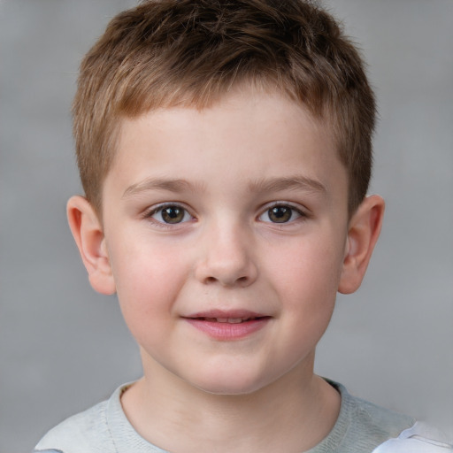 Joyful white child male with short  brown hair and grey eyes