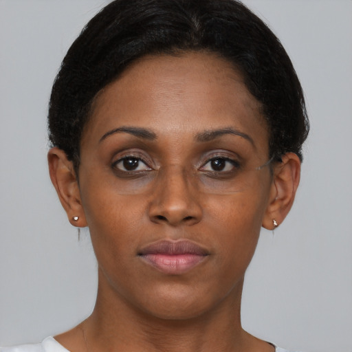 Neutral black young-adult female with short  brown hair and brown eyes