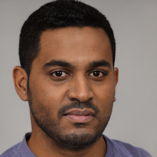 Neutral black young-adult male with short  black hair and brown eyes