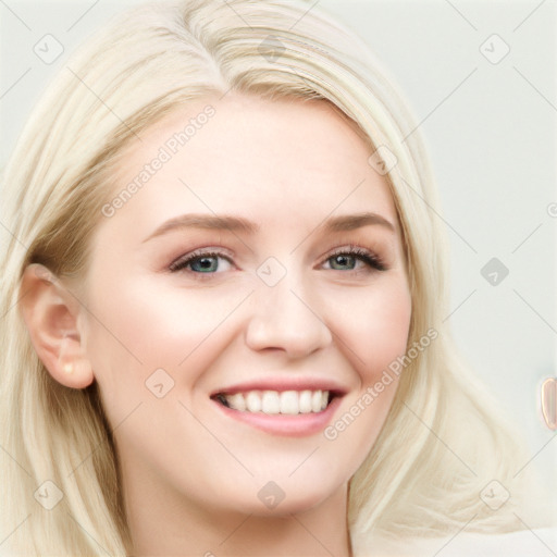 Joyful white young-adult female with long  brown hair and blue eyes