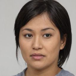 Neutral asian young-adult female with medium  brown hair and brown eyes