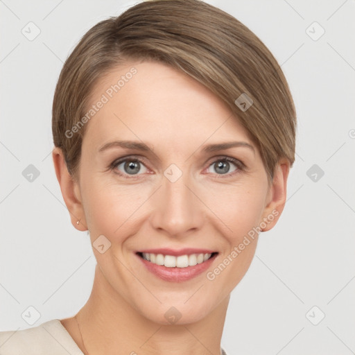 Joyful white young-adult female with short  brown hair and grey eyes