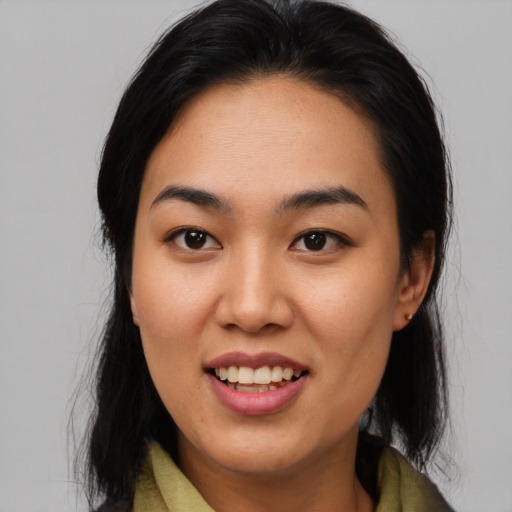 Joyful latino young-adult female with medium  black hair and brown eyes