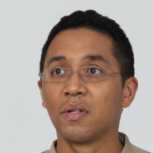 Neutral latino adult male with short  black hair and brown eyes