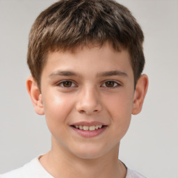 Joyful white child male with short  brown hair and brown eyes