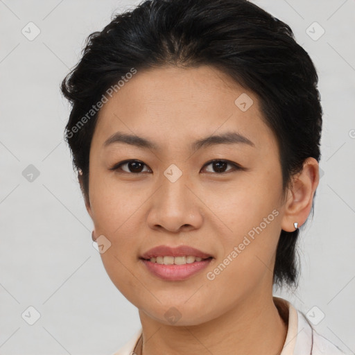 Joyful asian young-adult female with short  brown hair and brown eyes