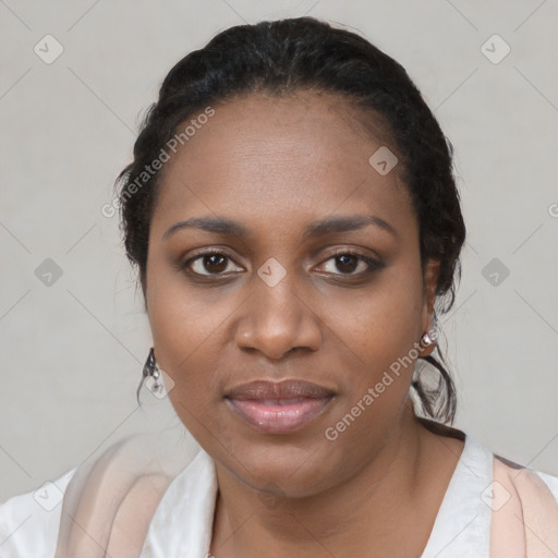 Joyful black young-adult female with short  black hair and brown eyes