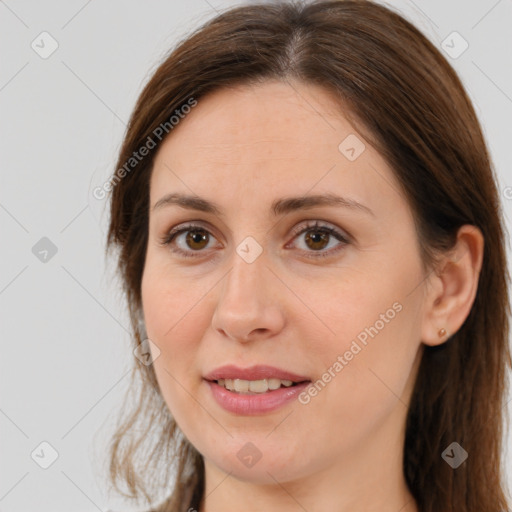 Joyful white adult female with long  brown hair and brown eyes