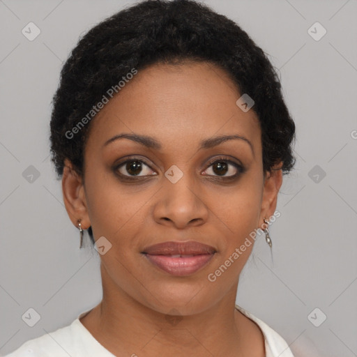 Joyful black young-adult female with short  brown hair and brown eyes