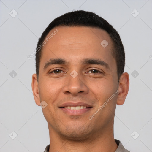 Joyful white young-adult male with short  black hair and brown eyes