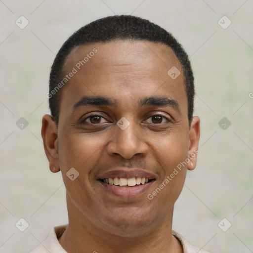 Joyful latino young-adult male with short  brown hair and brown eyes