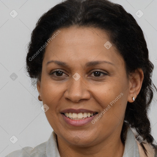 Joyful latino adult female with short  brown hair and brown eyes