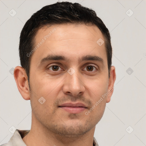 Joyful white young-adult male with short  brown hair and brown eyes