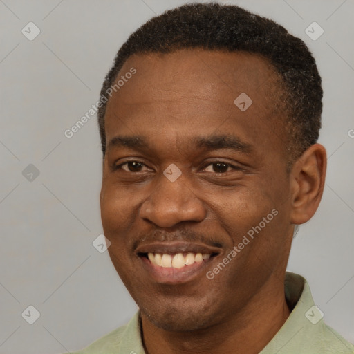 Joyful black young-adult male with short  brown hair and brown eyes