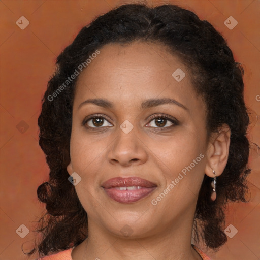 Joyful black adult female with medium  brown hair and brown eyes