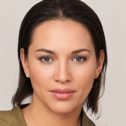 Joyful white young-adult female with medium  brown hair and brown eyes