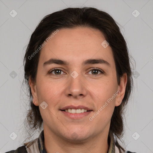 Joyful white adult female with medium  brown hair and brown eyes