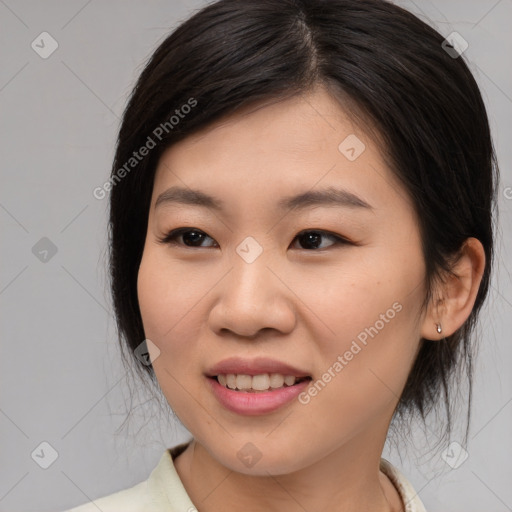 Joyful asian young-adult female with medium  brown hair and brown eyes