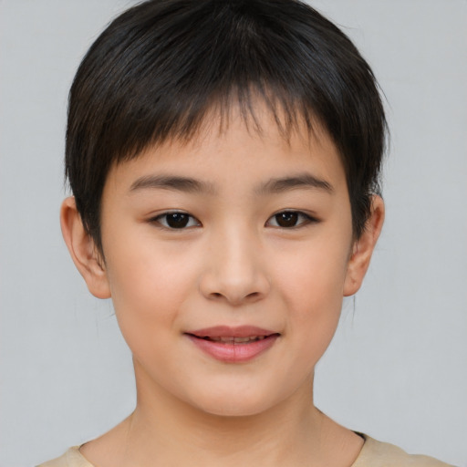Joyful asian child female with short  brown hair and brown eyes