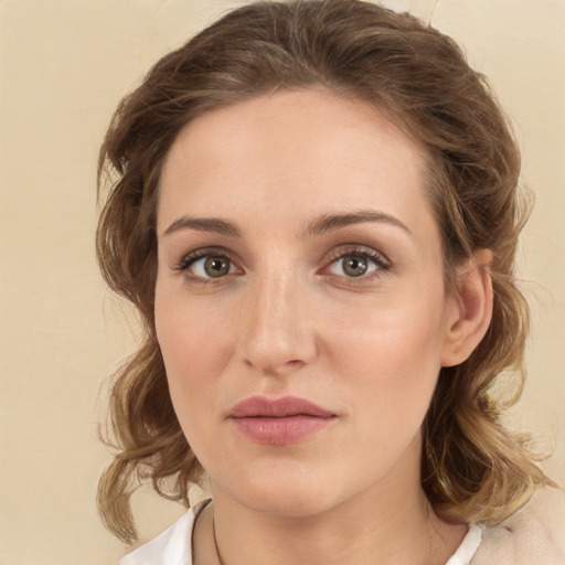 Joyful white young-adult female with medium  brown hair and green eyes