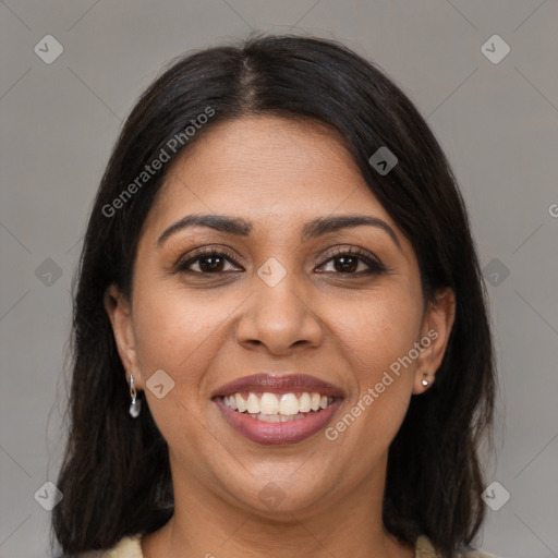 Joyful latino young-adult female with medium  brown hair and brown eyes