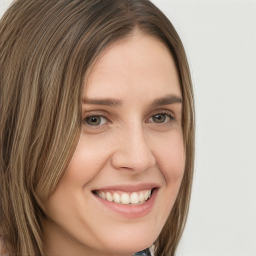 Joyful white young-adult female with long  brown hair and grey eyes