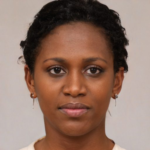 Neutral black young-adult female with short  brown hair and brown eyes