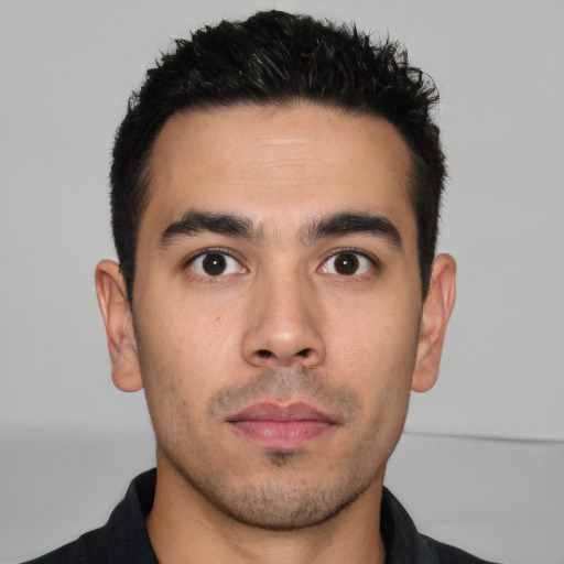 Neutral white young-adult male with short  black hair and brown eyes