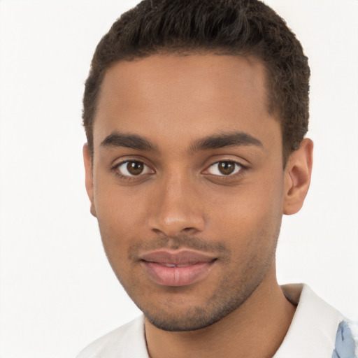 Joyful latino young-adult male with short  brown hair and brown eyes