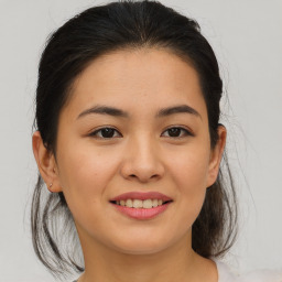 Joyful asian young-adult female with medium  brown hair and brown eyes