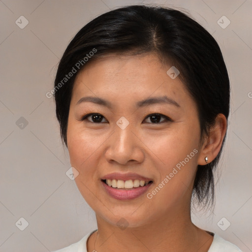 Joyful asian young-adult female with medium  brown hair and brown eyes