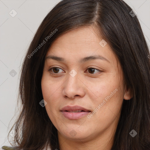 Joyful white adult female with long  brown hair and brown eyes