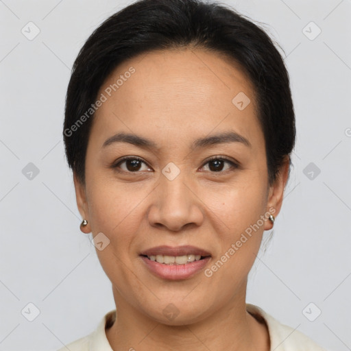 Joyful latino young-adult female with short  brown hair and brown eyes