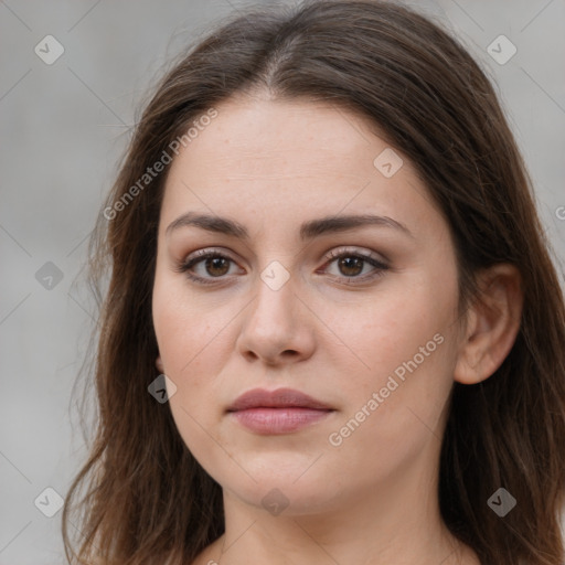 Neutral white young-adult female with long  brown hair and brown eyes