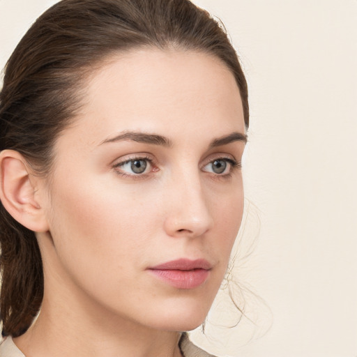 Neutral white young-adult female with medium  brown hair and grey eyes