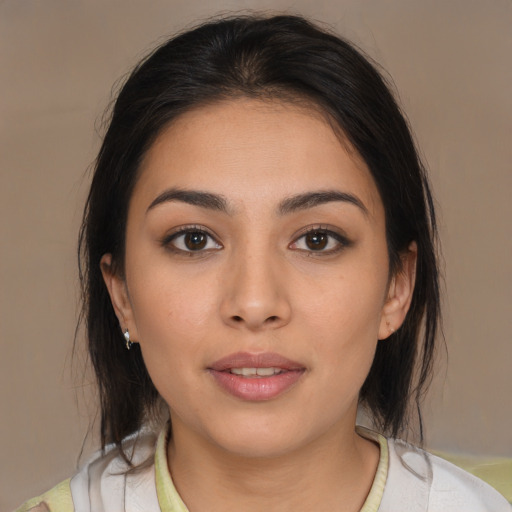 Neutral latino young-adult female with medium  brown hair and brown eyes