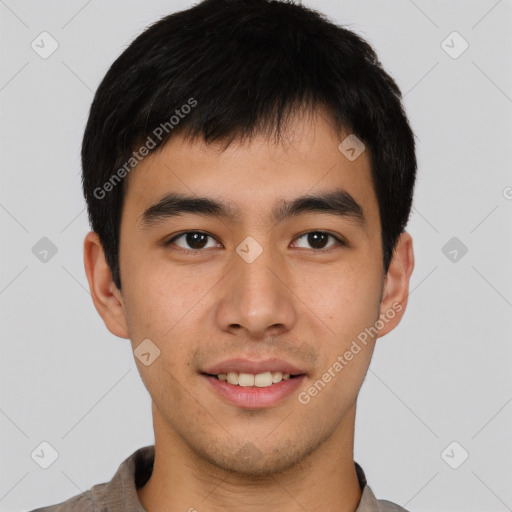 Joyful asian young-adult male with short  brown hair and brown eyes